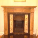 Original cast iron insert with pine surround and granite hearth